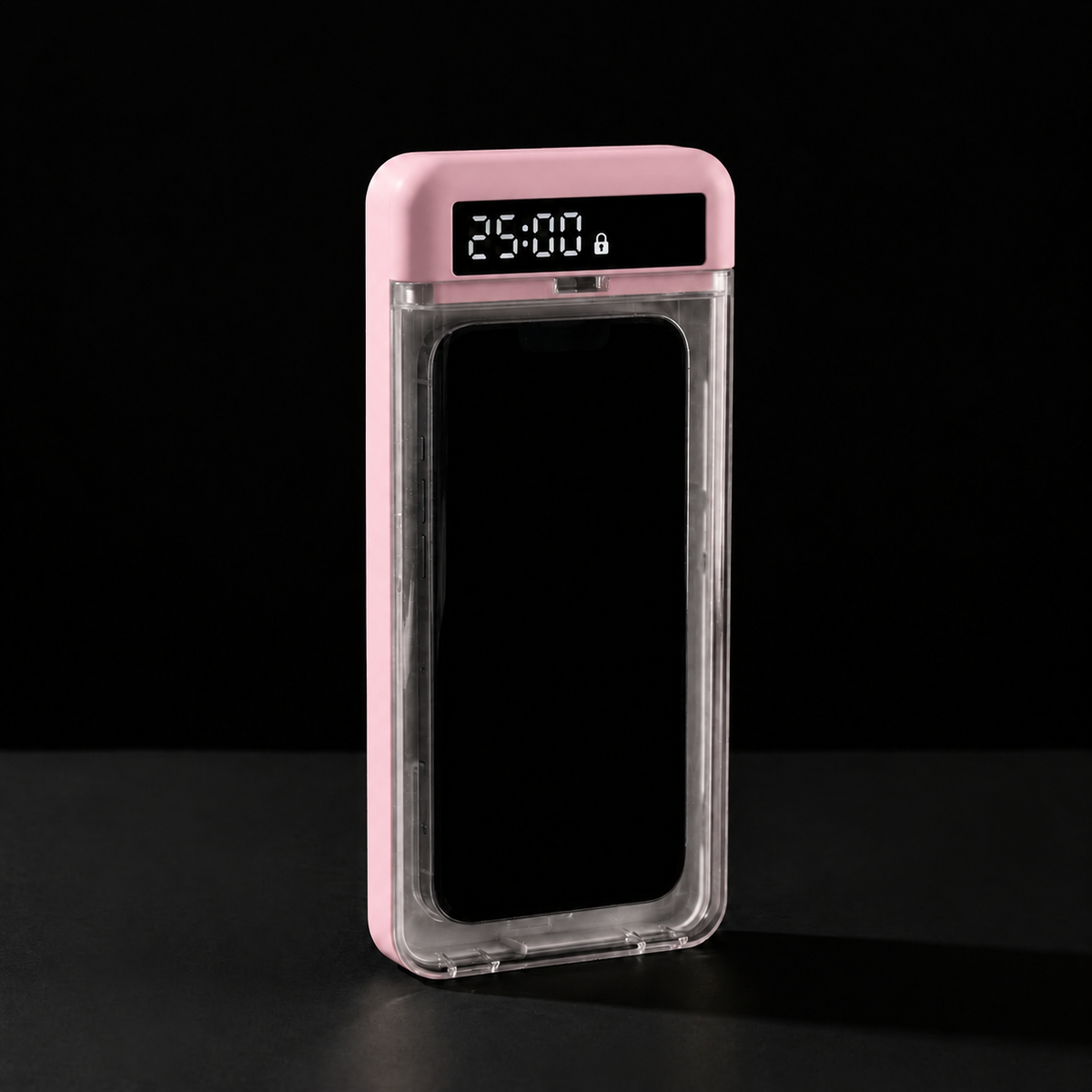 Caja de bloqueo rosa con un móvil dentro y 25:00 en la pantalla, sobre fondo negro